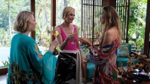 Carrie Coon, Leslie Bibb, and Michelle Monaghan with wine glasses in 'The White Lotus' Season 3