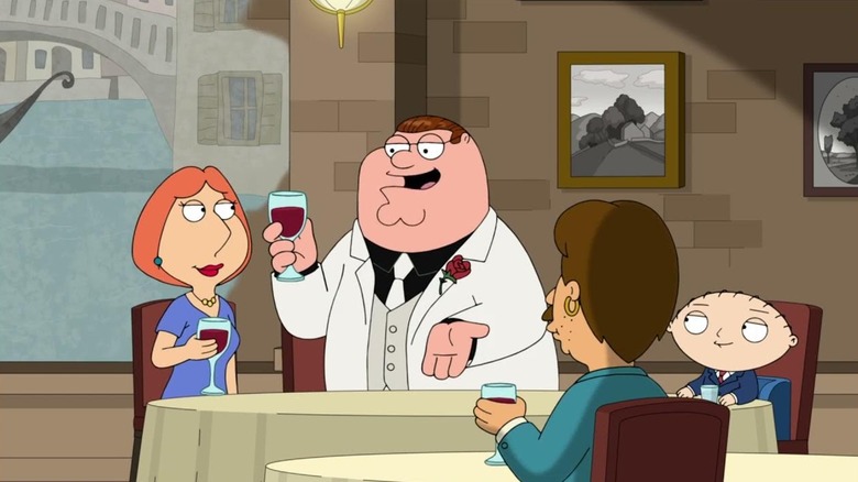 Peter Griffin, in a white suit with a glass of wine, toasting Lois in an Italian restaurant. From Family Guy.