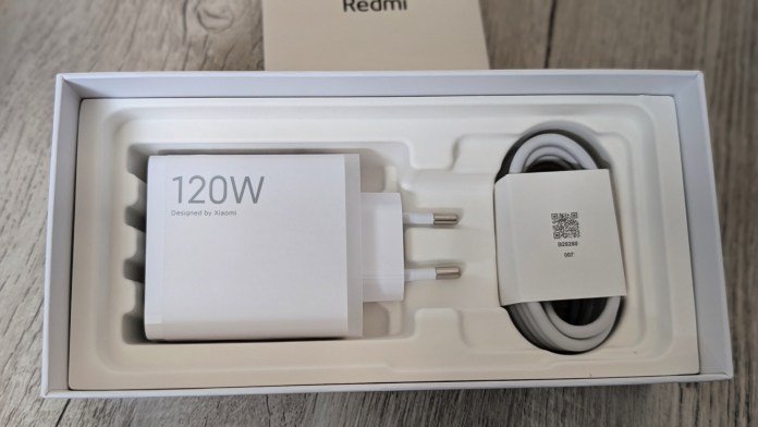 A boxed 120W charger and cable designed by Xiaomi, arranged neatly in protective packaging.