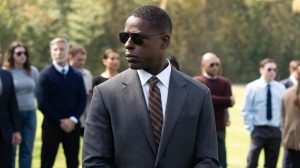 Sterling K Brown in 'Paradise,' a Hulu show, shown here wearing a suit and sunglasses outside