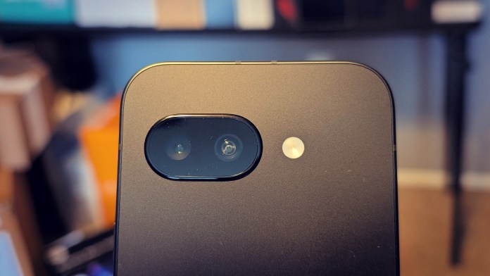 Close-up of the rear camera module on the Google Pixel 9A, featuring a dual-camera setup and a flash, showcasing a sleek matte finish.