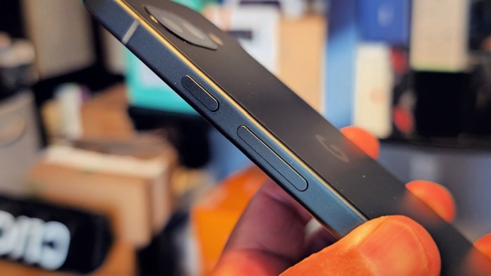Close-up view of the side of a Google Pixel 9A smartphone showcasing the buttons and camera cutout.