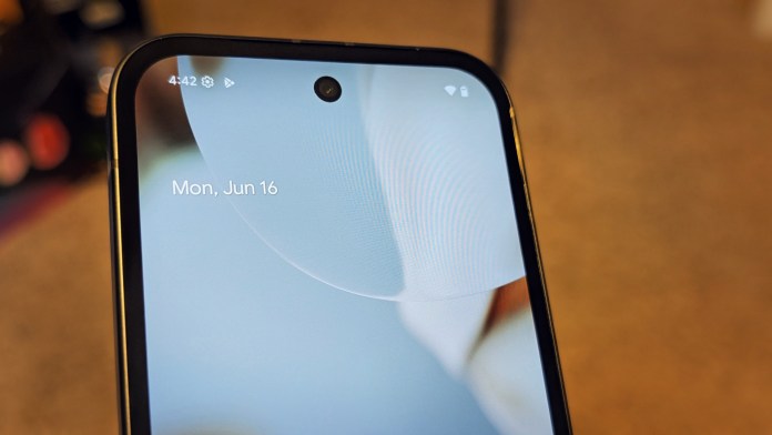 Close-up of the Google Pixel 9A smartphone's display showing the date 'Mon, Jun 16' and a front camera cutout.