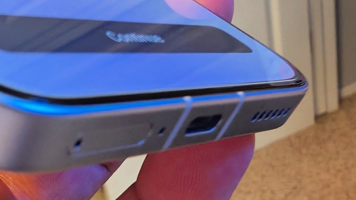 Close-up of the POCO F7 smartphone showcasing its edge design, ports, and surface details.