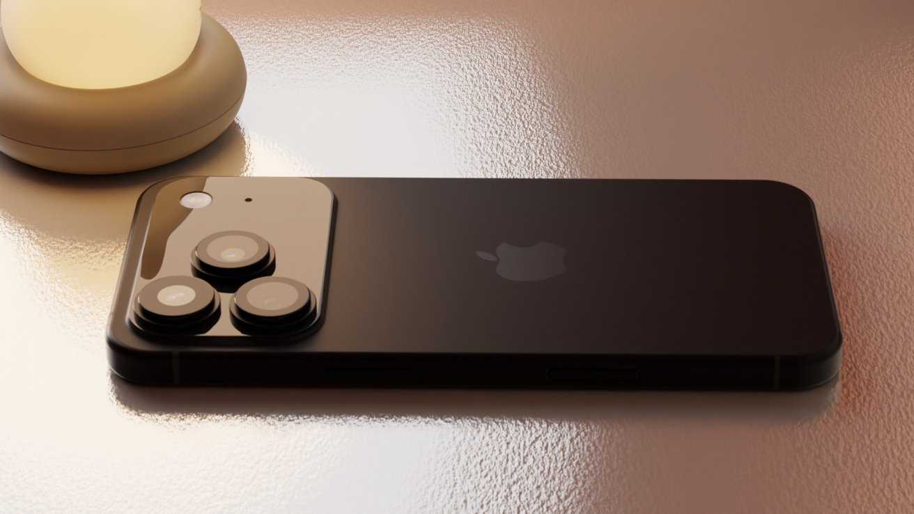 Black smartphone with triple-lens camera and logo on the back, lying on a reflective surface near a small lamp.
