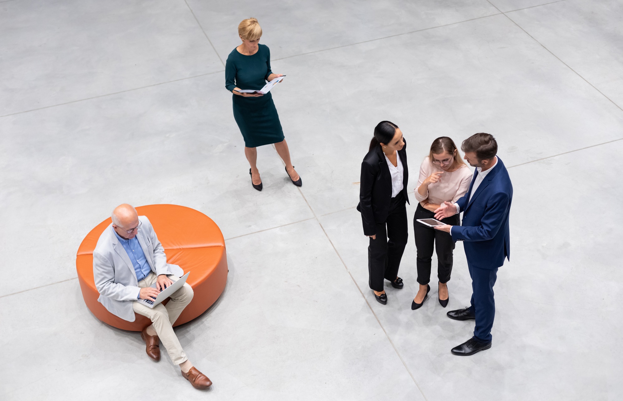 Diverse group of business people of all ages top view in modern interior