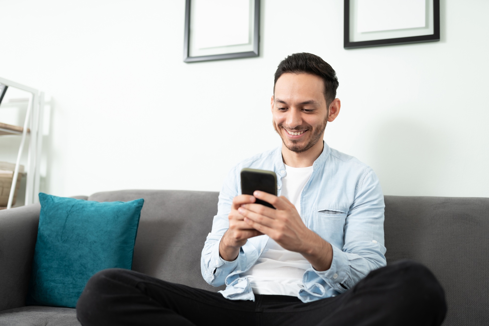 Happy guy checking social media