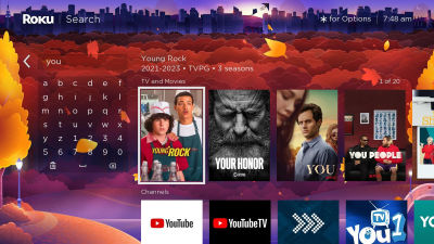 Roku TV interface showing an on-screen grid keyboard used for text input, with a search query partially entered and matching content displayed on the right. This illustrates the standard grid layout commonly used for TV search.