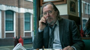 'Slow Horses' stars Gary Oldman as Jackson Lamb, shown here on the phone in a restaurant