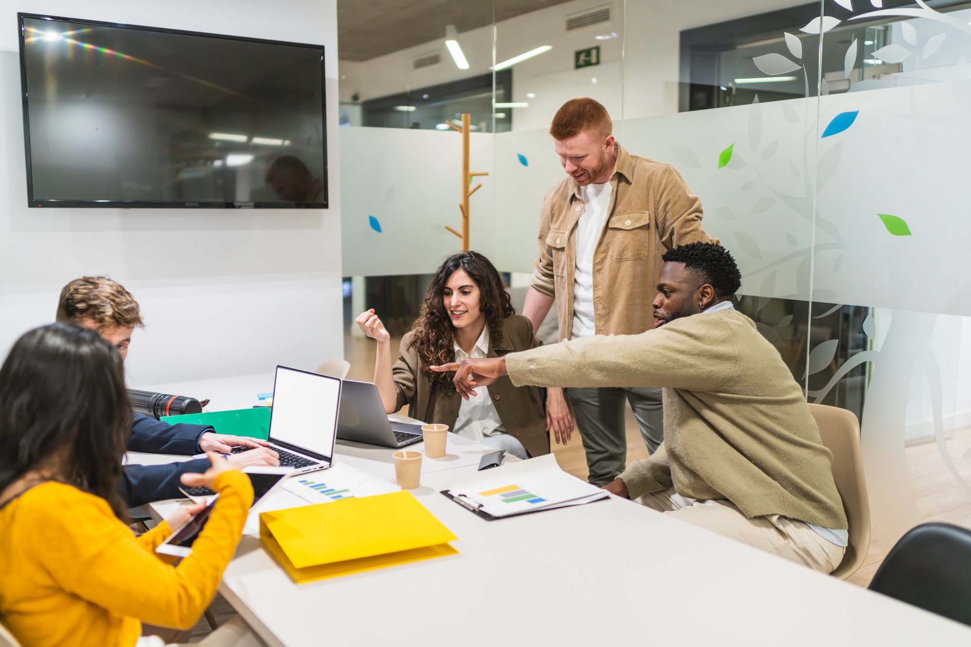 Marketing professionals collaborating on project in modern office