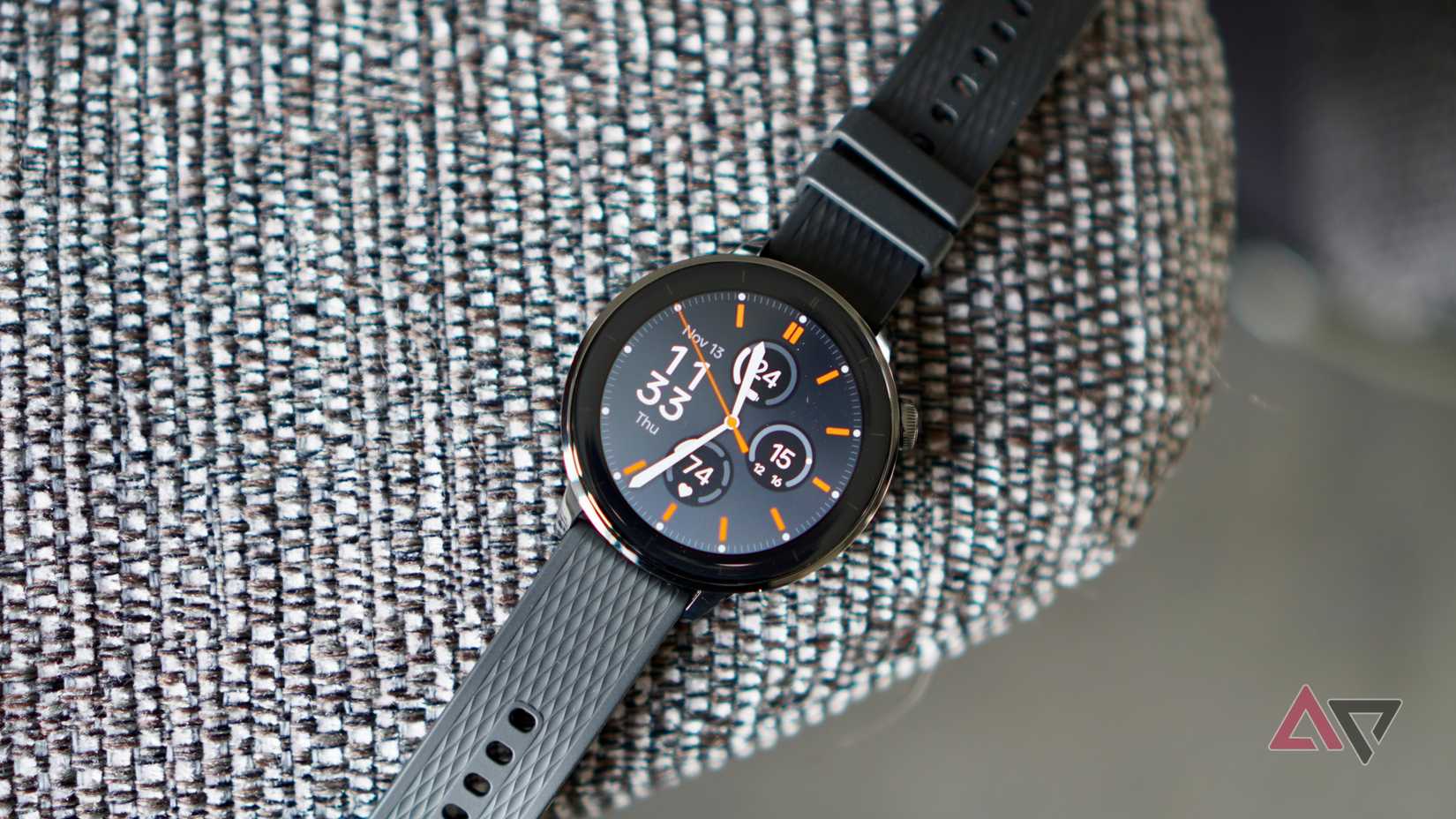 The OnePlus Watch 3 43mm on the arm of a chair