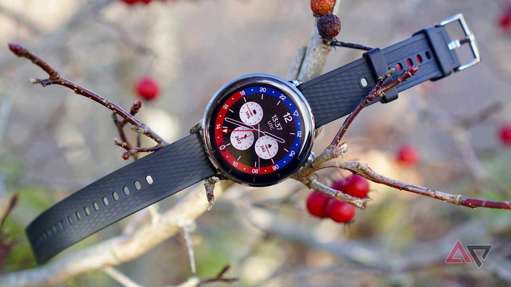 The OnePlus Watch 3 43mm on a tree branch