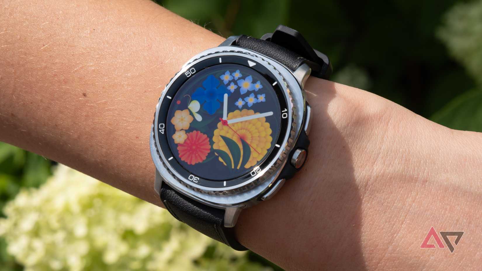 The Samsung Galaxy Watch 8 Classic on a wrist with a floral face